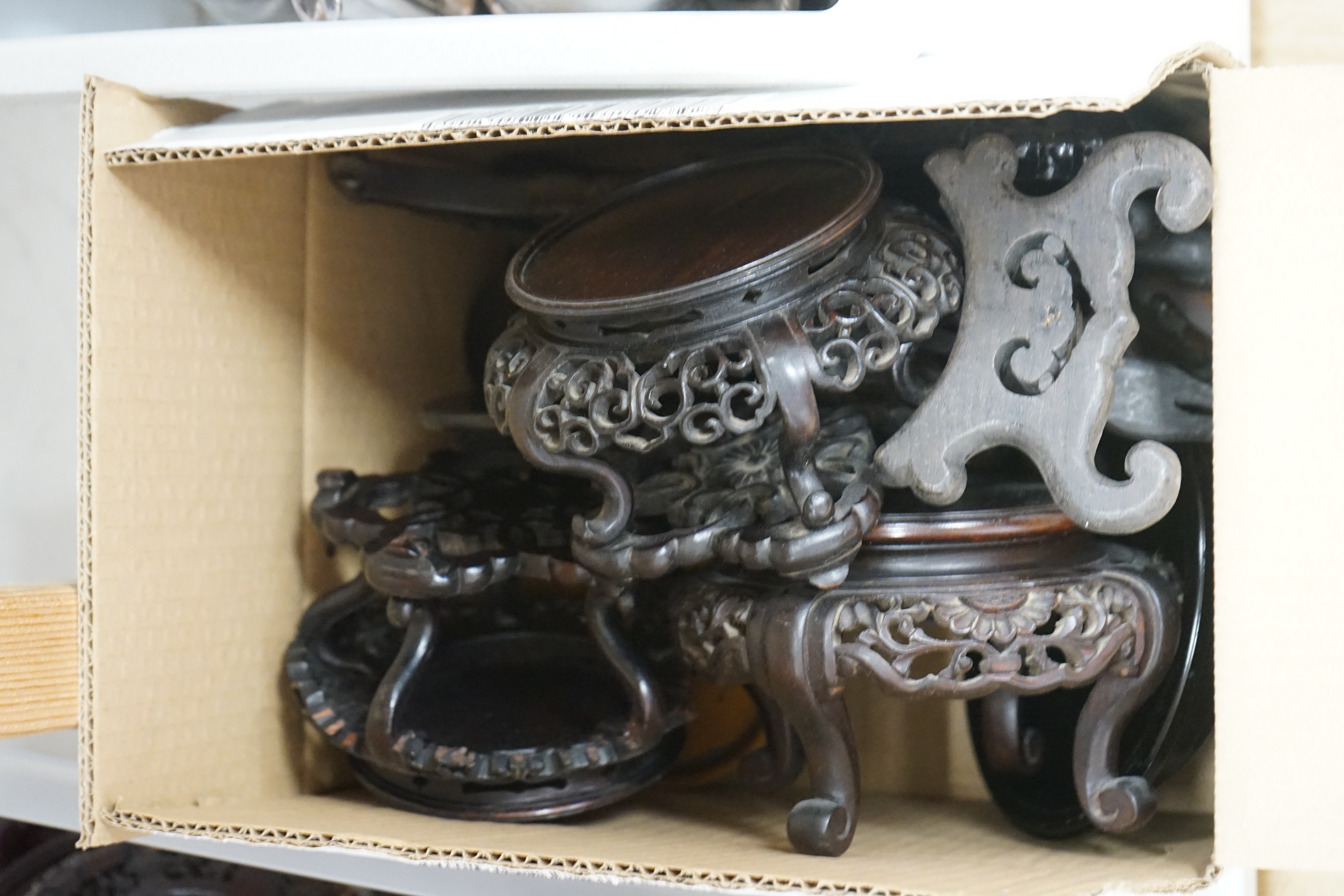 A large collection of Chinese carved hardwood stands, largest 29cm diameter. Condition - varies, poor to fair